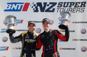 Richard Moore (right) celebrates a win with his V8 SuperTourer co-driver Tim Slade last season.
